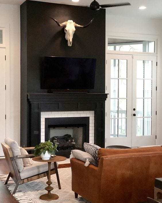 Making A Case For Black Paint Black Living Room Black Fireplace Wall Black Rooms