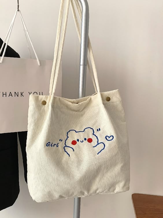 Olivia Mark - Cartoon & Letter Graphic Snap Button Tote Bag - Women Tote Bags Product Description Style Preppy Color White Quantity 1 piece Strap Type Double Handle Pattern Type Cartoon Pattern Type Letter Bag Size Medium Details Embroidery Type Shoulder Tote Bag Material Corduroy Composition 100% Viscose Size Chart INCH CM Size Bag Width Bag Height Bag Length one-size 4.3 12.6 13 Size Bag Width Bag Height Bag Length one-size 11 32 33 Similar Products h2 { text-align: center; } .red-box { width: