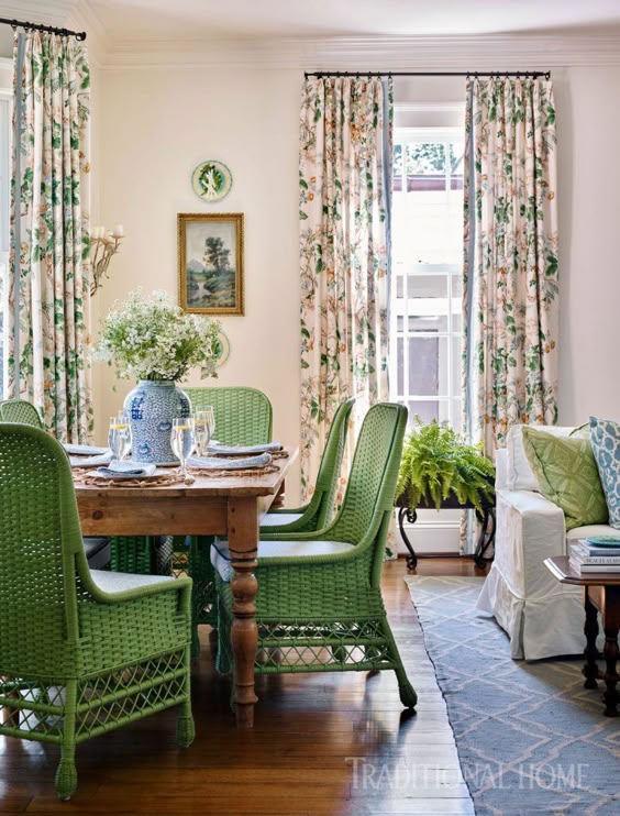 Sarah Bartholomew Traditional Colorful Decor. Vibrant green wicker dining chairs pull up to a pine farm table in a beautiful traditional home.