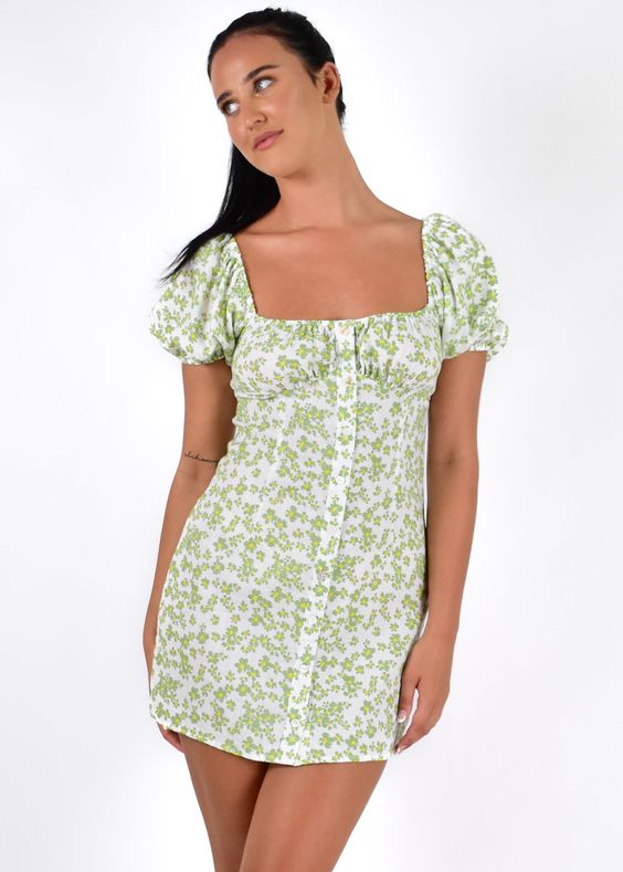Butter wouldn\'t melt with our sweet Randi Mini Dress! featuring subtle puff sleeves and a button down front, pair her with our Slidin by Therapy to add a layer of edge! Floral mini dress Puff sleeves Self tie back Back zip Button down front Material: Cotton Model wears size 8