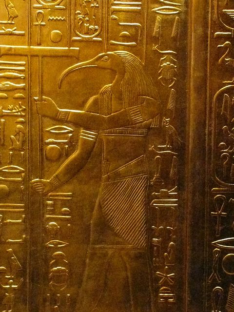 Thoth is typically depicted with the head of an ibis. His main duty is that of maintaining the universe (including reckoning time). But he also manifests as A'an, the god of equilibrium, in which case he is portrayed as a baboon. From the solid gold sarcophagus of King Tutankhamen.