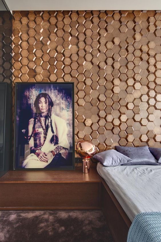 A Bedroom Accent Wall Made From 3D Hexagonal Wood Tiles