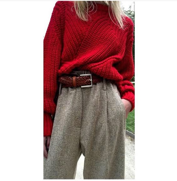 Loose red cardigan high neck longe sleeve tuked in, grey baggy trousers. Fall/Winter Trends.