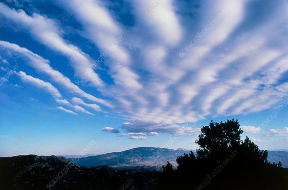 Banded stratocumulus clouds over mountains - Stock Image - E120/0403 - Science Photo Library