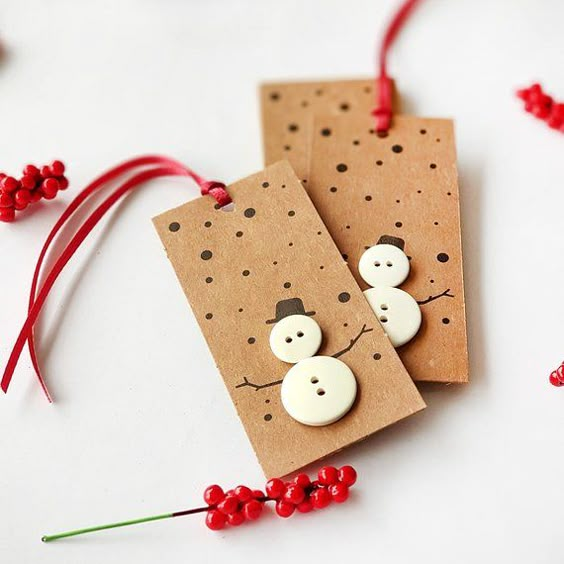 Kraft gift tags with buttons arranged as snowmen