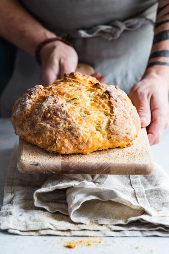 Crusty Irish Soda bread with grated vintage cheddar and rosemary mixed all through the dough. You definitely need this for your St Patrick's Day dinner! #stpatricksday #irishsodabread #sodabread #Stpattys
