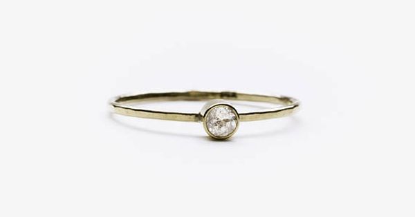 A Slim Band Of Polished Sterling Silver Or 14 Karat Gold And One