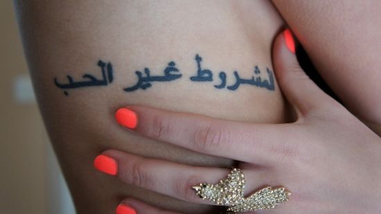 Soldier With A Tattoo Of The Arabic Word For Infidel Infidel Tattoo Military Tattoos Arabic Tattoo