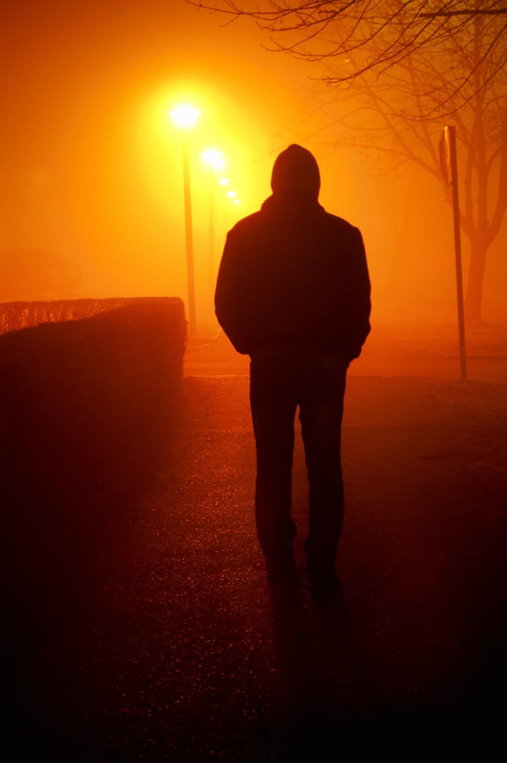 Silhouette - Man taking a walk on a foggy night | Silhouette man, Night ... Silhouette Man Walking Tunnel