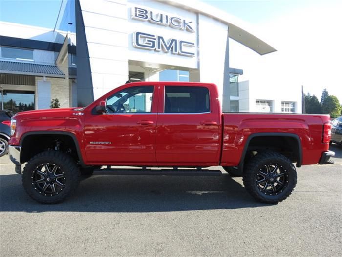 With a red lifted 2014 gmc sierra in the drive way ... With a red lifted 2014 gmc sierra in the drive way ...