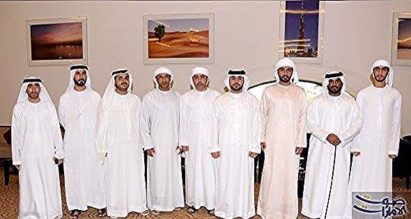 الشيخ راشد بن حميد النعيمي يحضر مأدبة غداء محمد الهوني حضر الشيخ راشد بن حميد النعيمي رئيس دائرة البلدية والتخطيط في عجمان مأدبة الغداء Lab Coat Fashion Coat