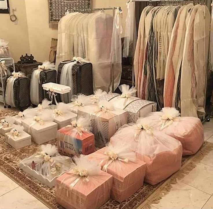 a room filled with lots of different types of bags and boxes on top of a rug