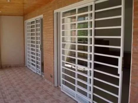 an empty balcony with sliding glass doors