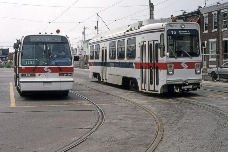 SEPTA GMC RTS 02 and Kawasaki LRV at Richmond Loop. Bus art, Street SEPTA GMC RTS 02 and Kawasaki LRV at Richmond Loop. Bus art, Street