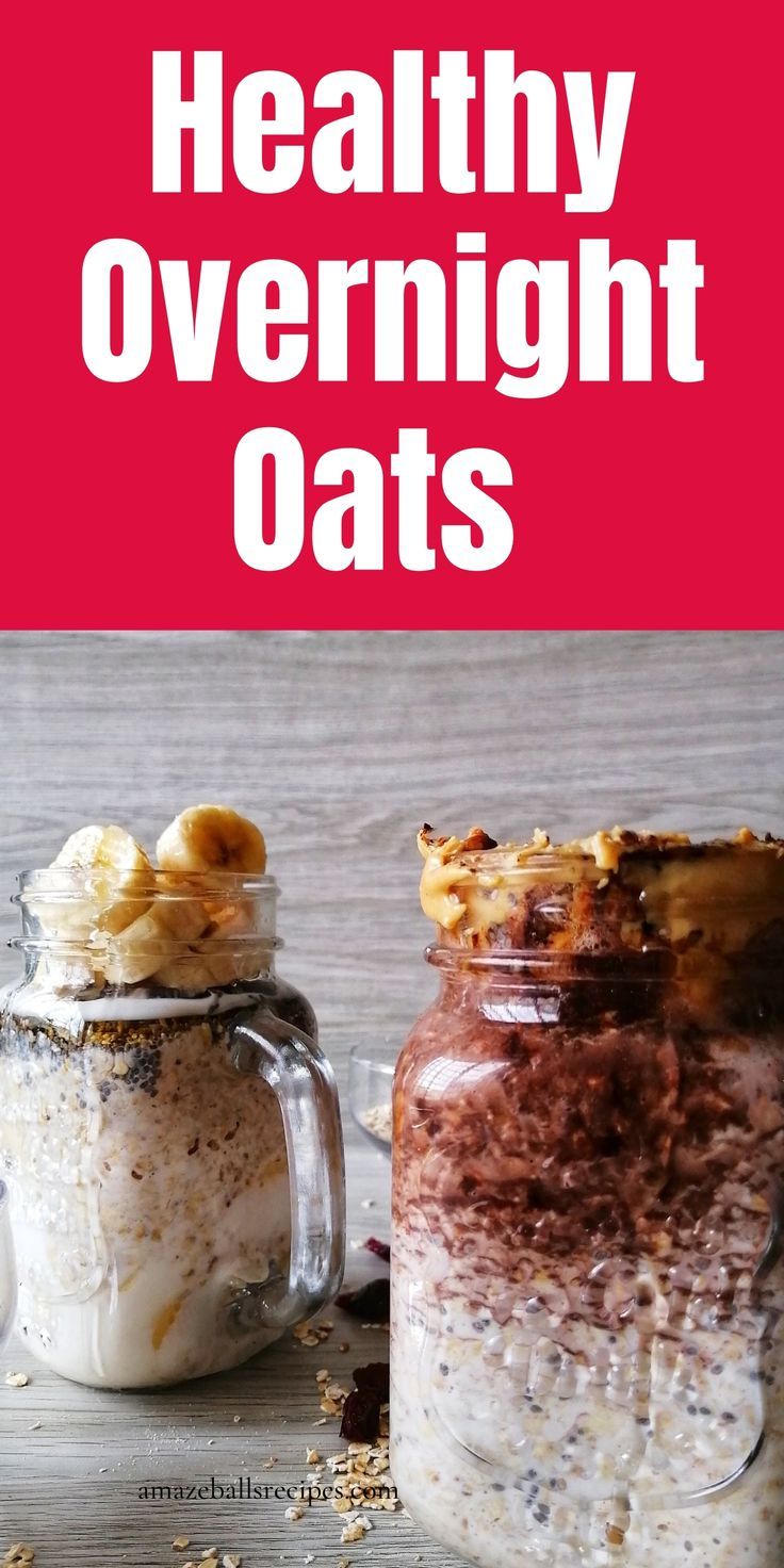 two jars filled with overnight oats on top of a wooden table