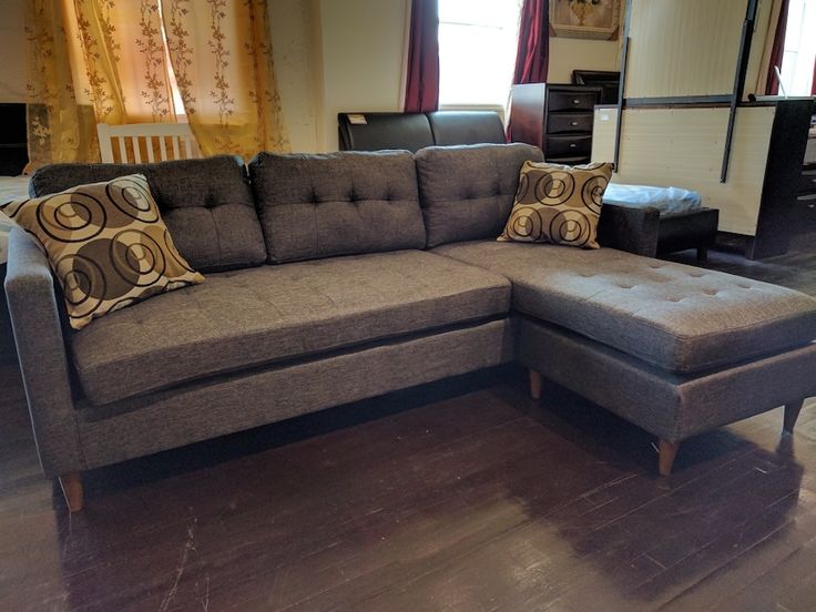 Modern grey tufted sectional sofa with throw pillows found for sale