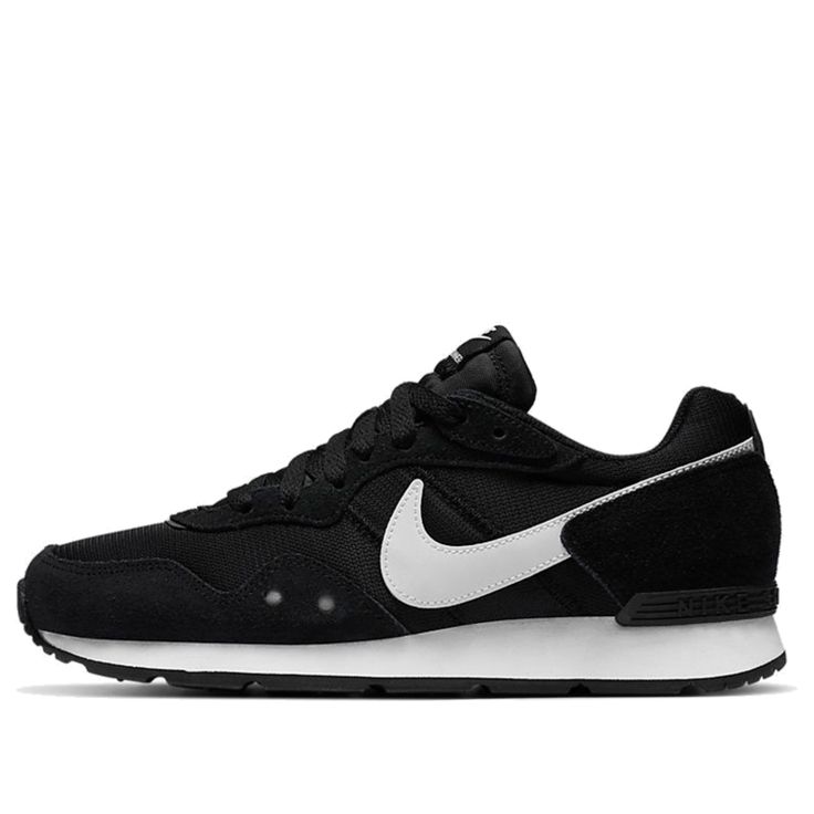 A Black And White Nike Air Vortex Sneaker On Top Of A White Background a-black-and-white-nike-air-vortex-sneaker-on-top-of-a-white-background