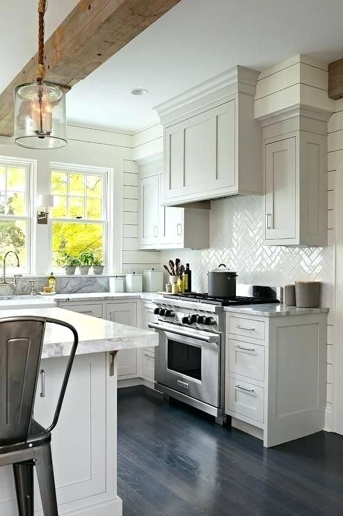 Herringbone Backsplash Tile Stunning Transitional Kitchen Features A Herringbone Backsplash Tile Stunning Transitional Kitchen Features A Stainless Steel Range Sat Against White Tiles Holding Gl