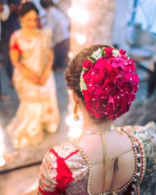 Big Bun with Rose Petals Indian Bridal hairstyles in Big Bun with Rose Petals Indian Bridal hairstyles in