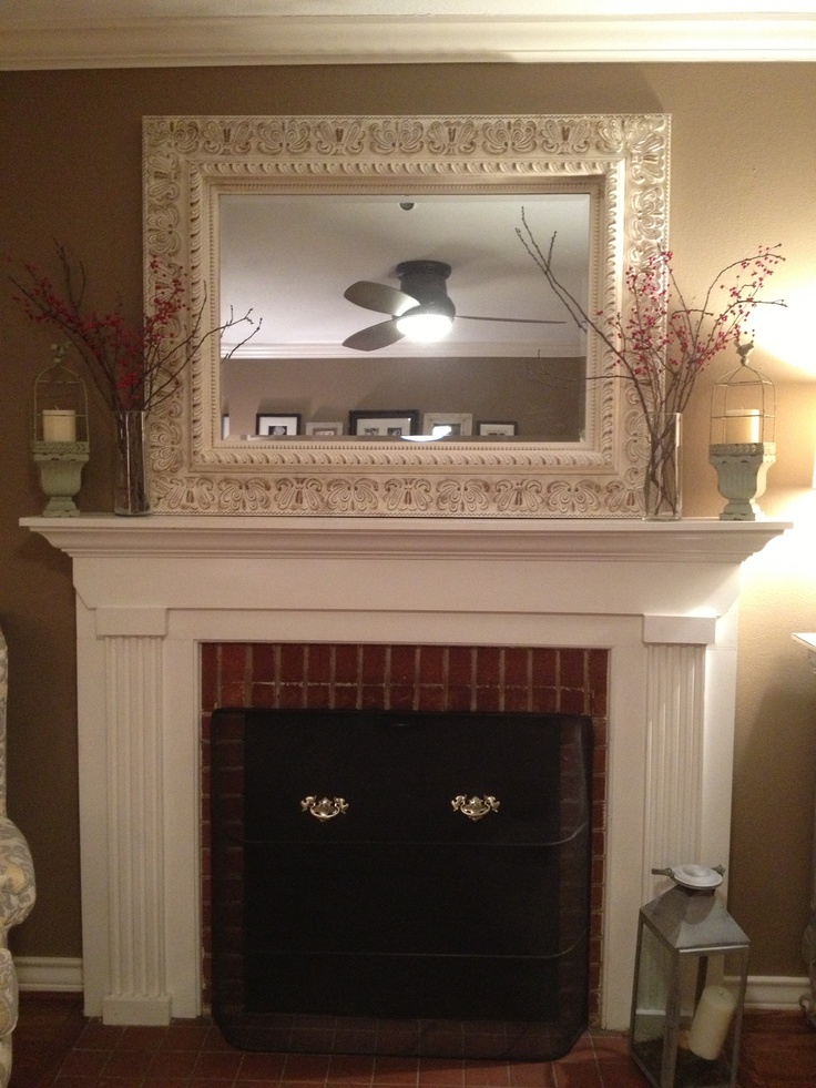 Love the distressed mirror over the fireplace | Fireplace decor, Over