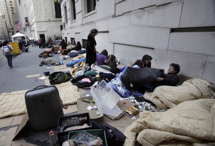 Occupy Wall Street participants occupy a sidewalk near the