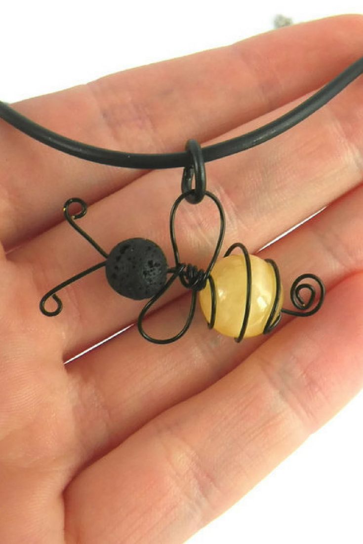A cute bee necklace to bring fun and summer to your day. Handmade with real quartz and lava stone gemstone beads. A perfect gift for beekeep...