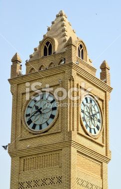 an old clock tower with two clocks on it's sides and the sky in the