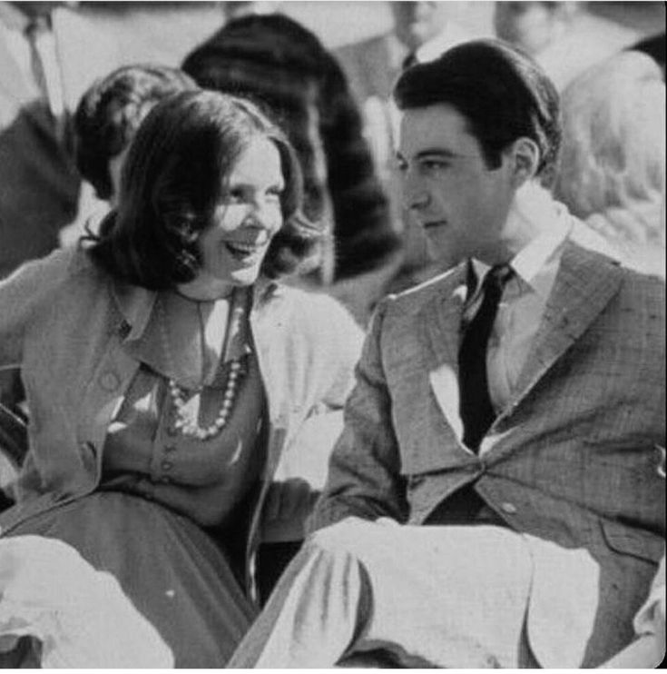 a man and woman sitting next to each other