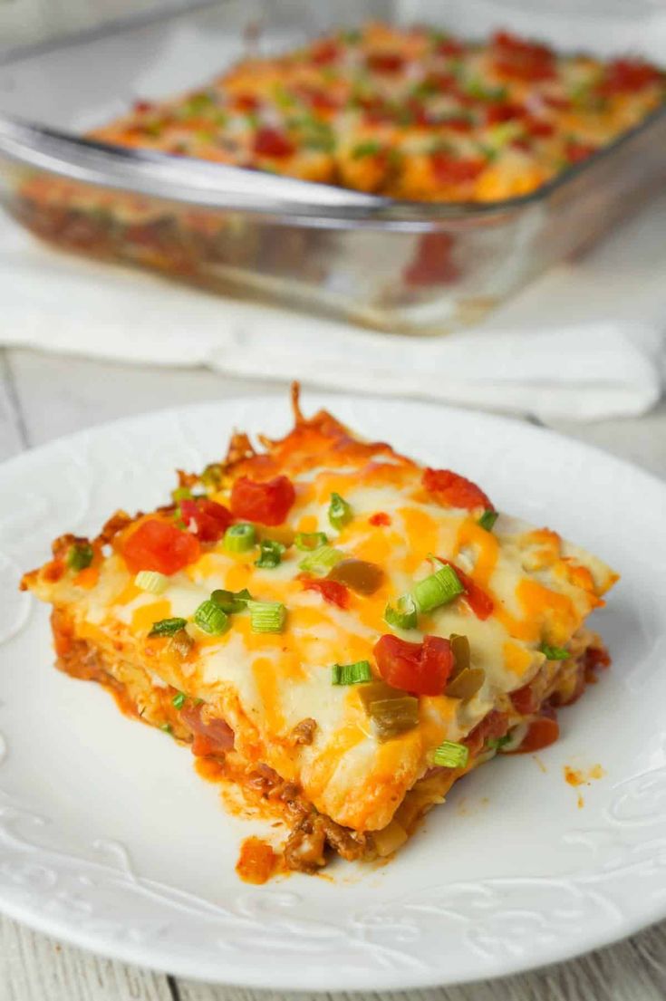 Taco Lasagna is an easy casserole recipe with layers of soft tortillas ...