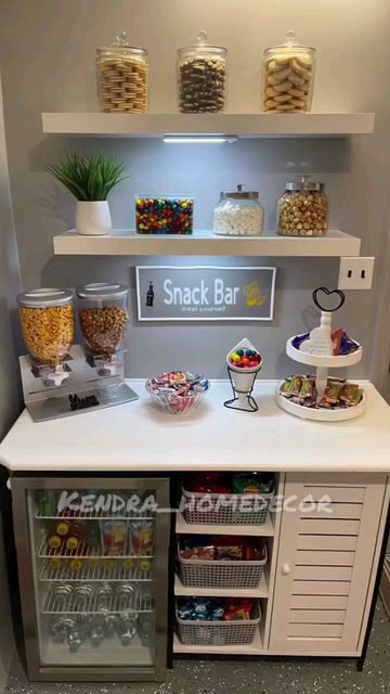 A Snack Bar With Lots Of Snacks And Drinks On The Counter In Front Of It a-snack-bar-with-lots-of-snacks-and-drinks-on-the-counter-in-front-of-it