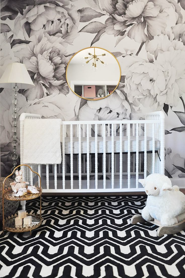 From the black and white floral wallpaper to the charming blush pink details, th...