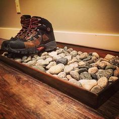 Put some rocks in a tray thingy for your wet boots. | 39 Low Key Ways To Trick E...