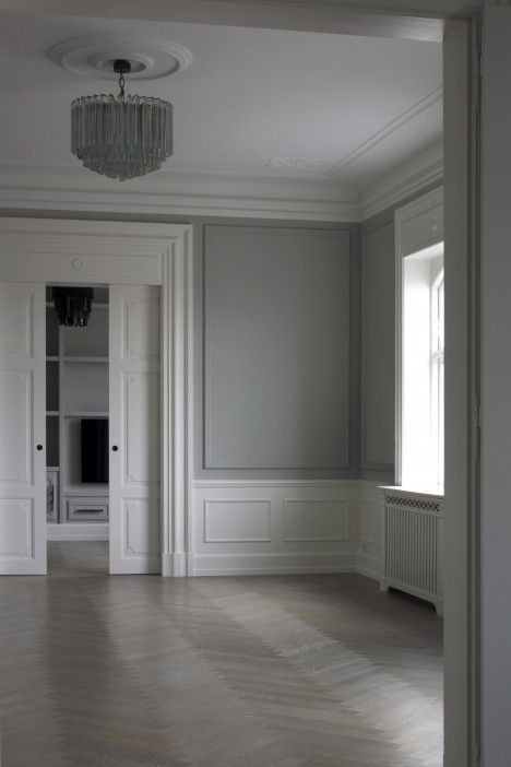 Grey walls with grey trim wainscoting in white~ Space