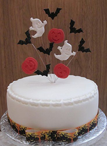 halloween cake topper with glittered moon bats and pumpk https