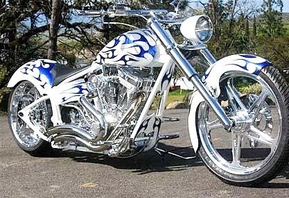 Blue flames on white bike and heaps of chrome. There are so many ...