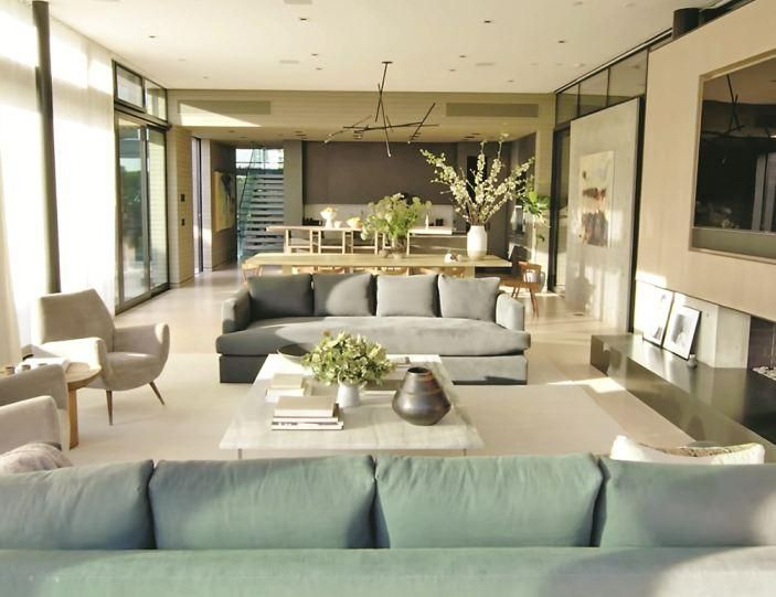 A Living Room Filled With Lots Of Furniture And Large Glass Doors a-living-room-filled-with-lots-of-furniture-and-large-glass-doors