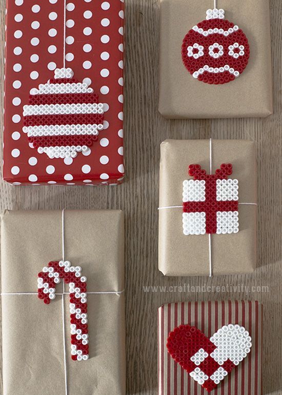 four different types of wrapped presents with bows and hearts on them, all decorated in red and white polka dots