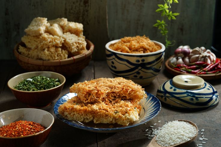 This may contain: an assortment of food items displayed in bowls on a table with spoons and spices This may contain: an assortment of food items displayed in bowls on a table with spoons and spices