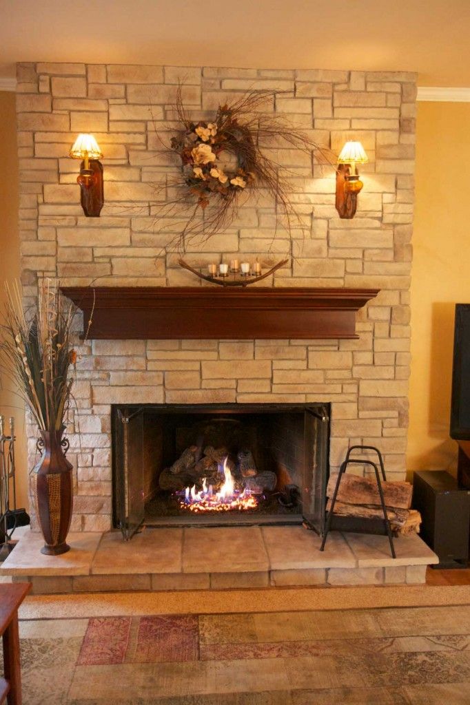 a living room filled with furniture and a fire place