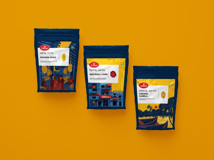 Three Bags Of Food Sitting On Top Of A Yellow Wall Next To Each Other three-bags-of-food-sitting-on-top-of-a-yellow-wall-next-to-each-other