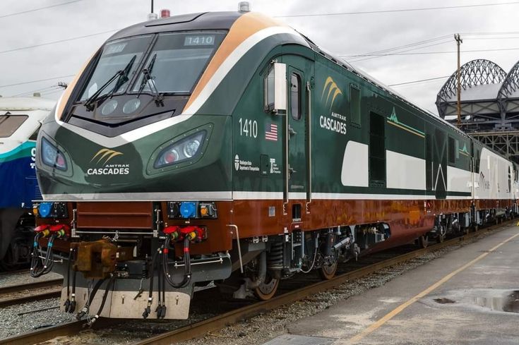 Two Colorful Trains on the Tracks - 2e3c463d3aaf2b1b411ad83caab4e434