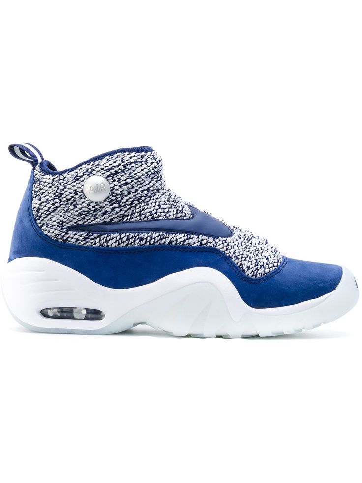 a blue and white sneaker with an animal print on the upper part of the shoe