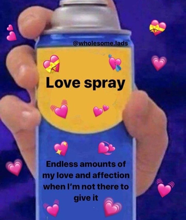 Someone Holding Up A Cell Phone With The Message Love Spray On It And someone-holding-up-a-cell-phone-with-the-message-love-spray-on-it-and