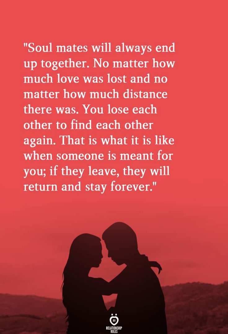 Two People Standing Next To Each Other In Front Of A Red Background two-people-standing-next-to-each-other-in-front-of-a-red-background