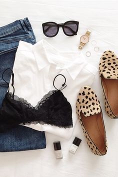 Blue jeans, a white cotton shirt, black lace bra, leopard flats, and all the right accessories. This is the perfect outfit.