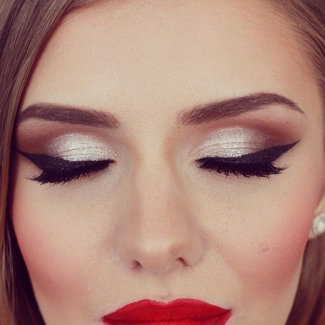 a close up of a woman with makeup on her face