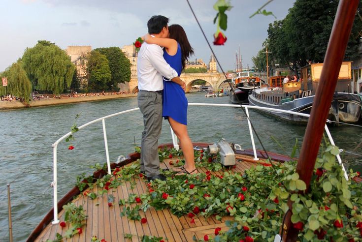 A romantic Paris proposal on the Seine while being showered in A romantic Paris proposal on the Seine while being showered in