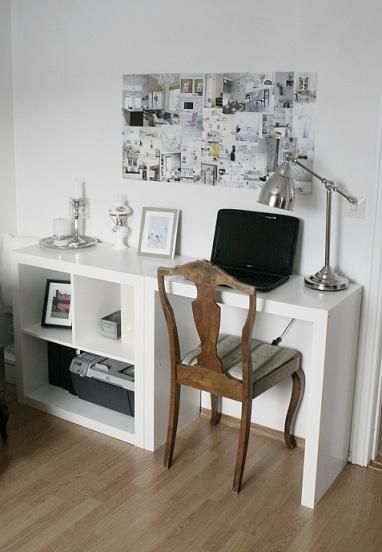 a room with a desk, chair and pictures on the wall