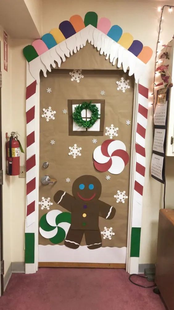 A Door Decorated With Gingerbreads Snowflakes And Candy Canes a-door-decorated-with-gingerbreads-snowflakes-and-candy-canes