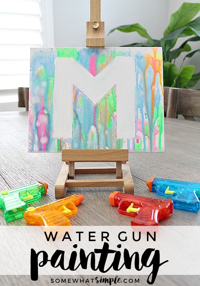 Water Gun Painting | If you're looking for some fun, inexpensive art projects for kids this summer, add painting with water guns to your list! | Somewhat Simple Summer Crafts For Kids, Summer Activities For Kids, Arts And Crafts For Kids, Art Activities, Diy For Kids, Kids Crafts, Summer Kids, Activies For Kids, Outside Activities For Kids